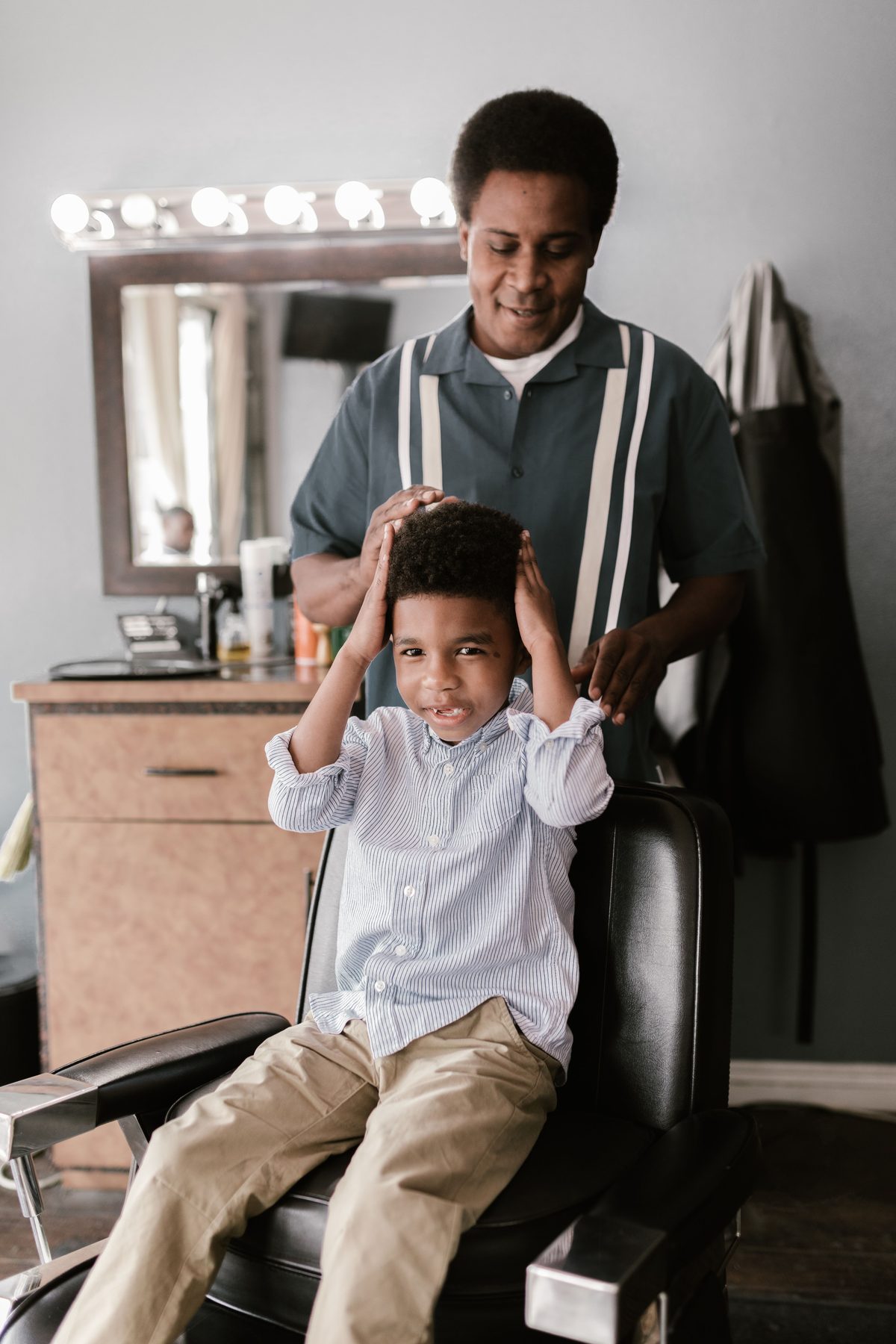 Cozy barbershop trim hairstyle shown on a boy under 12.