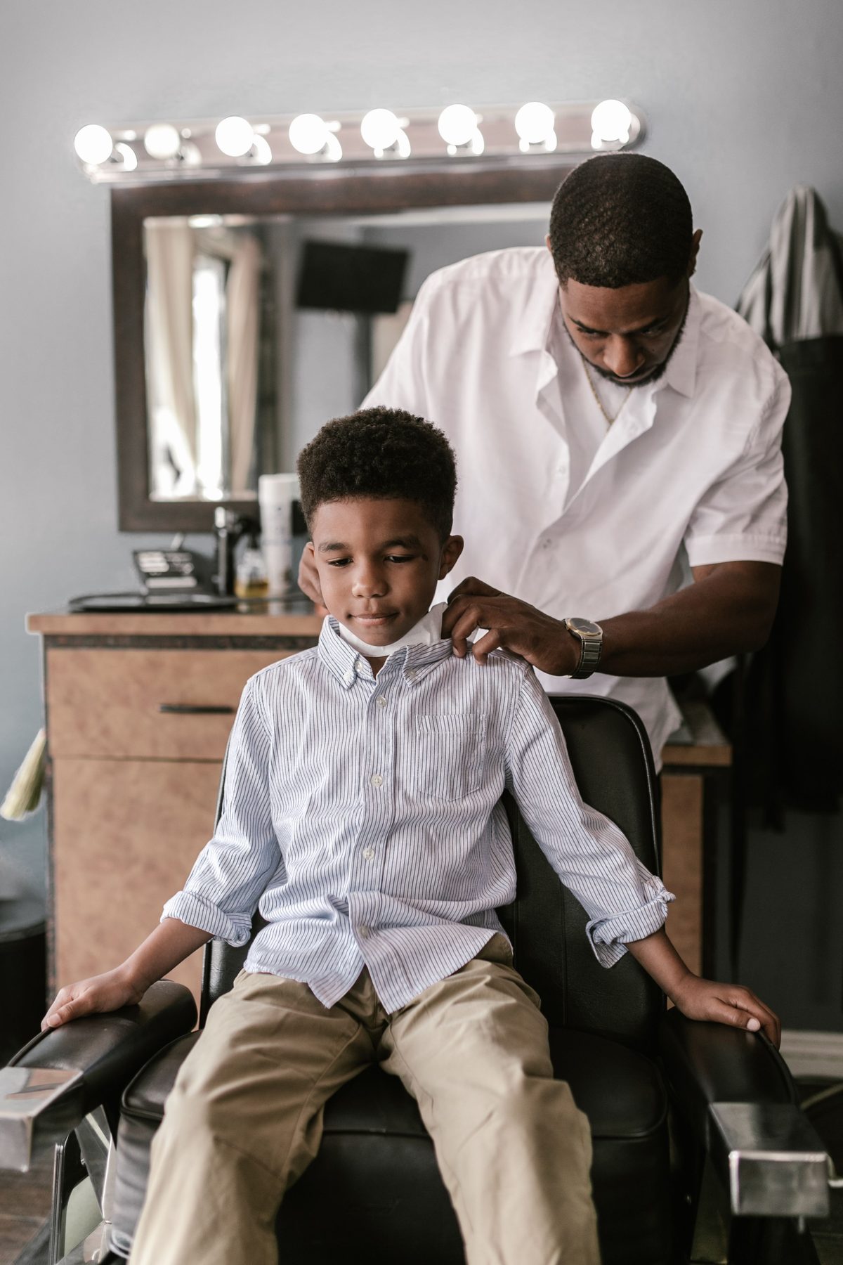 Chair-ready fresh cut hairstyle shown on a boy under 12.