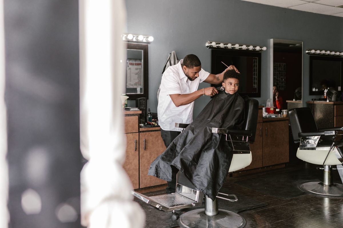 Gentle barber service hairstyle shown on a boy under 12.
