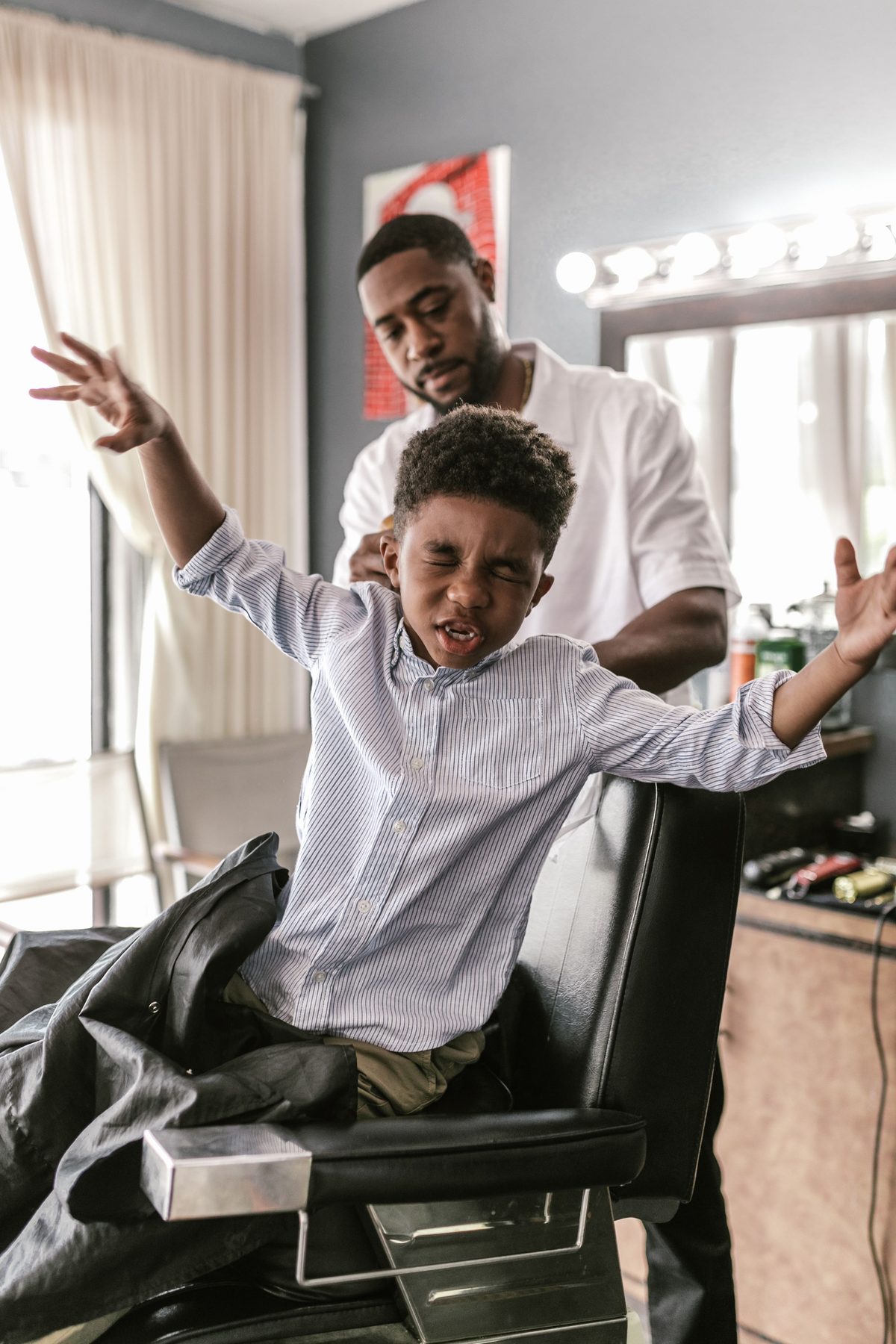Playful expression cut hairstyle shown on a boy under 12.