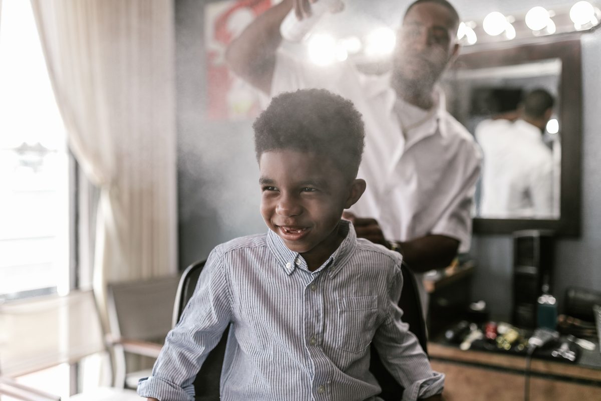 Cheerful lively trim hairstyle shown on a boy under 12.