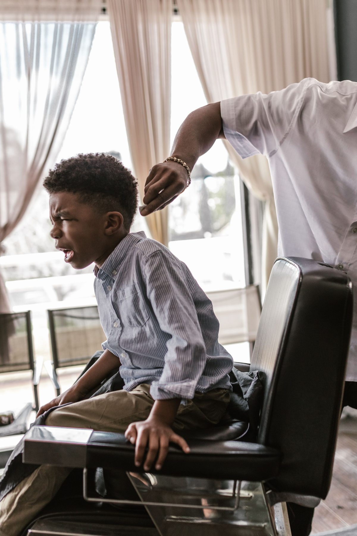 Natural light haircut hairstyle shown on a boy under 12.