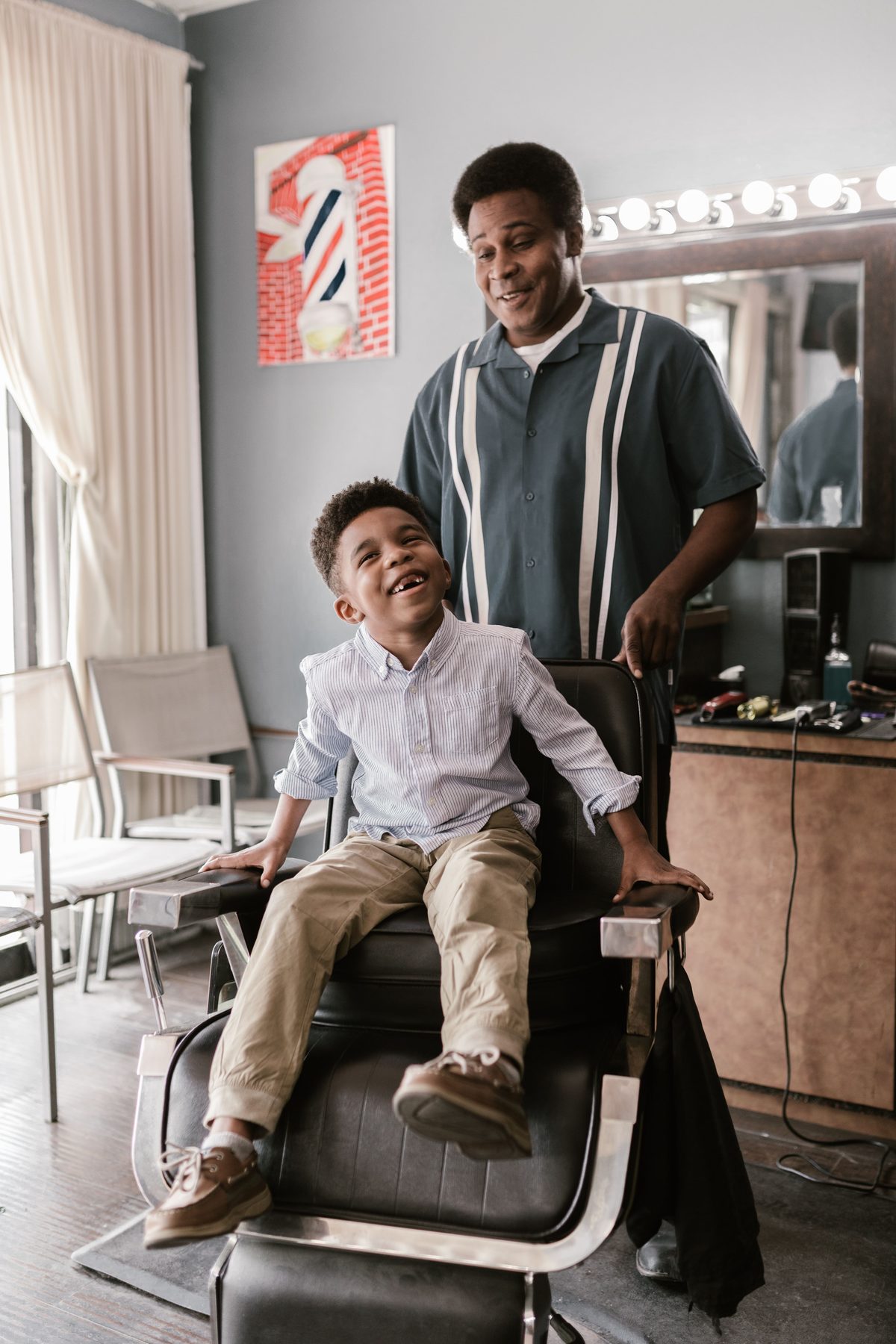 Happy chair experience hairstyle shown on a boy under 12.