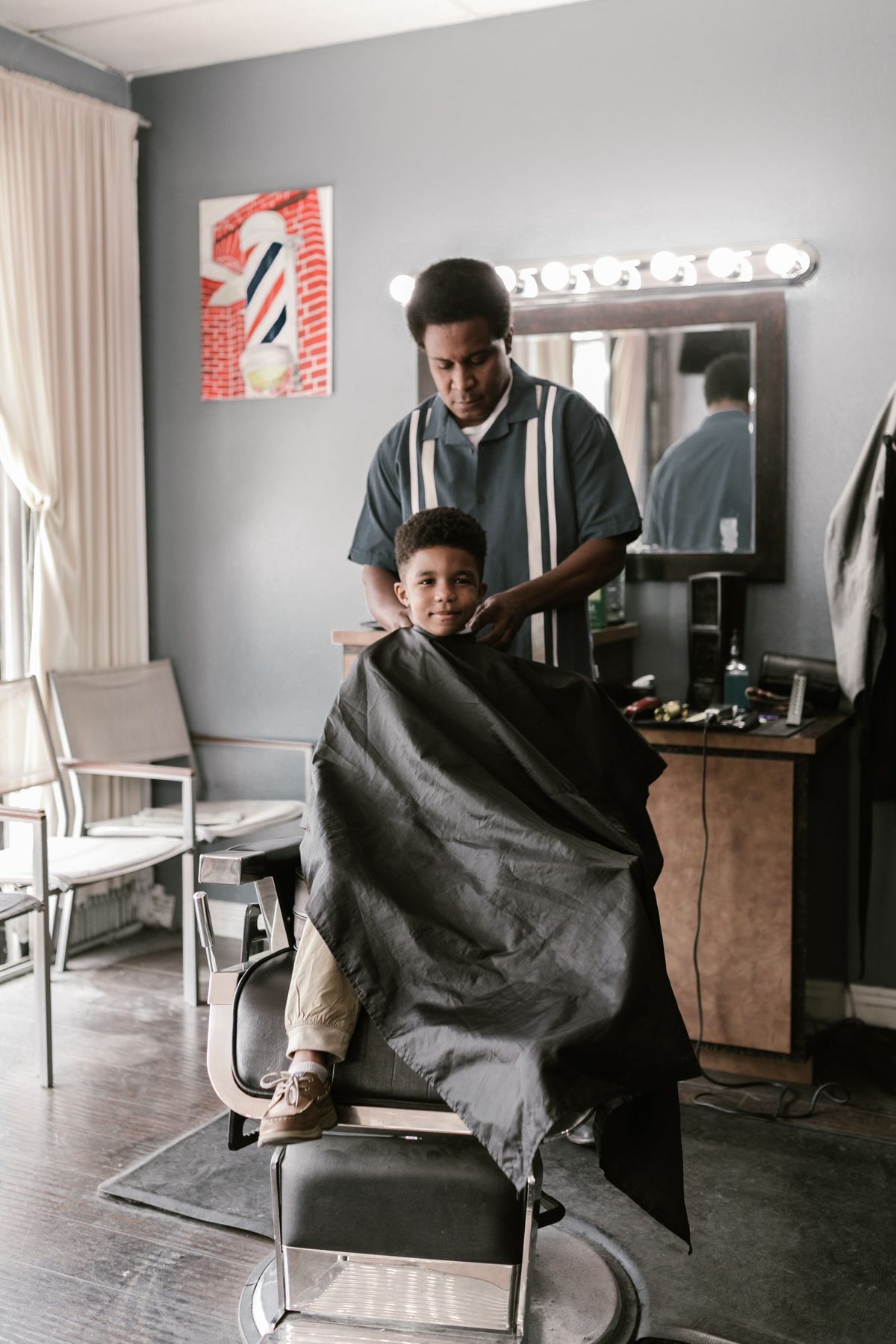 Warm cape-and-cut hairstyle shown on a boy under 12.