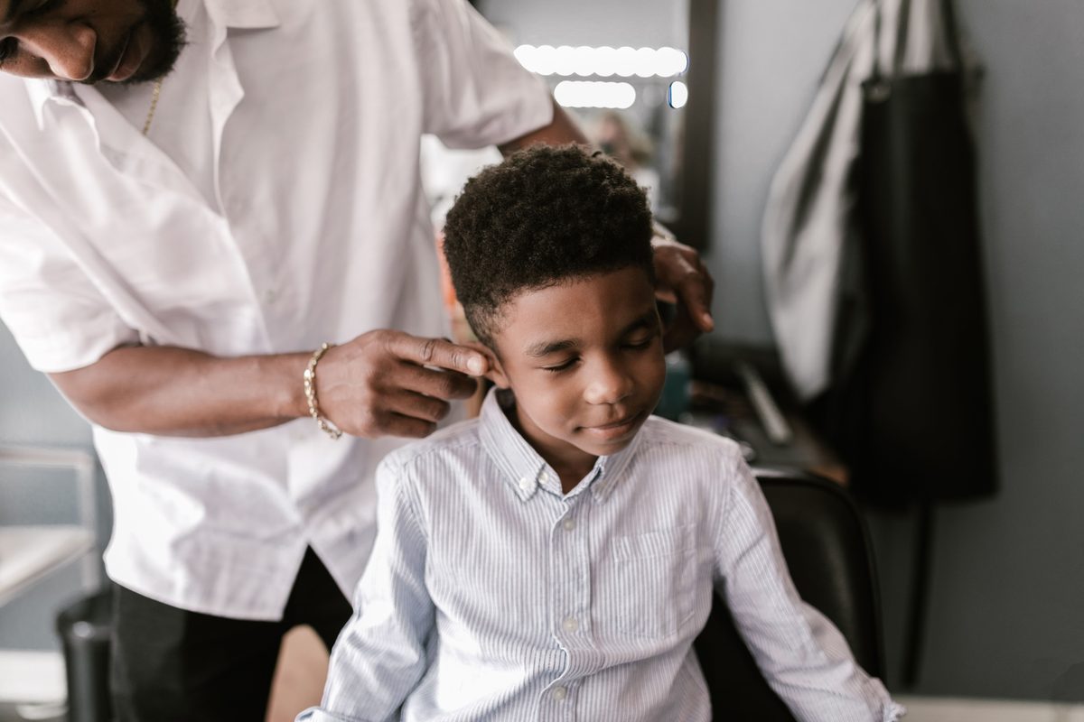 Salon styling session hairstyle shown on a boy under 12.