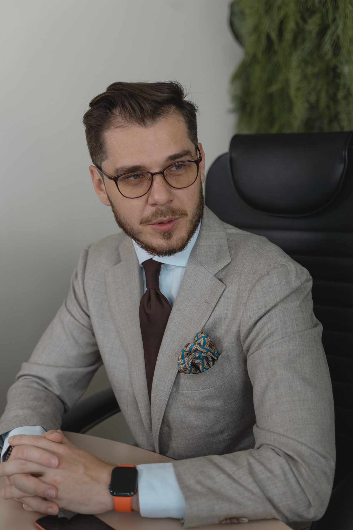 Gray suit office professional hairstyle shown on a professional man.