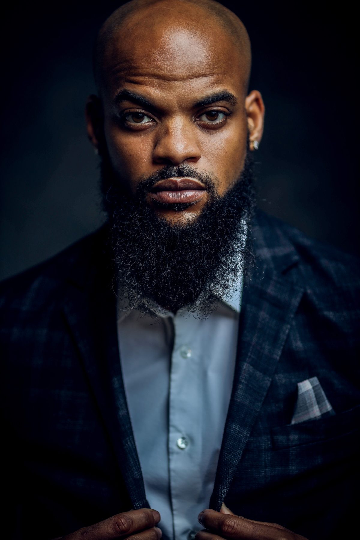 Handsome suit portrait hairstyle shown on a professional man.