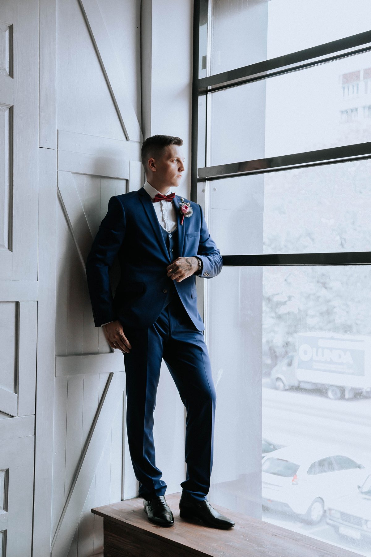 Window suit portrait hairstyle shown on a professional man.
