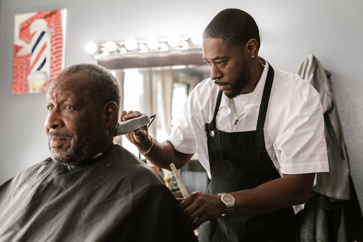 Mature Client Master Cut hairstyle shown on a professional man.
