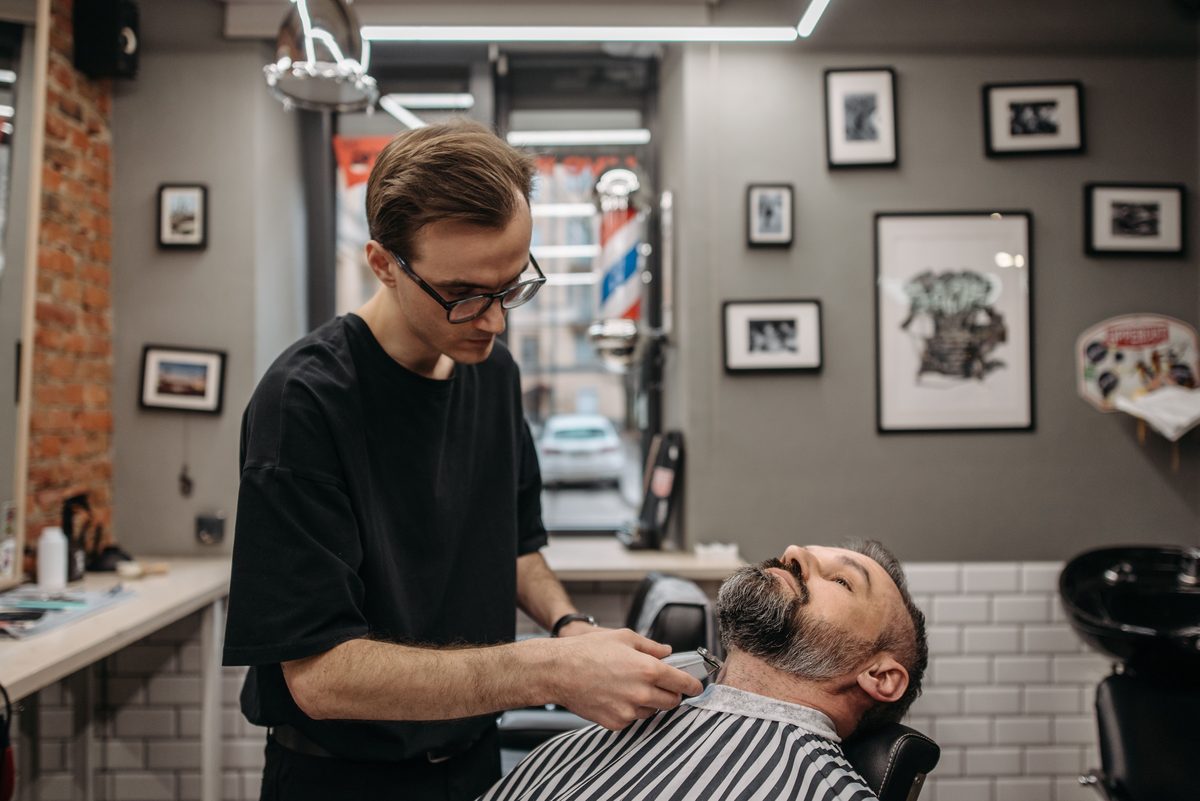 Barbershop Signature Finish hairstyle shown on a professional man.