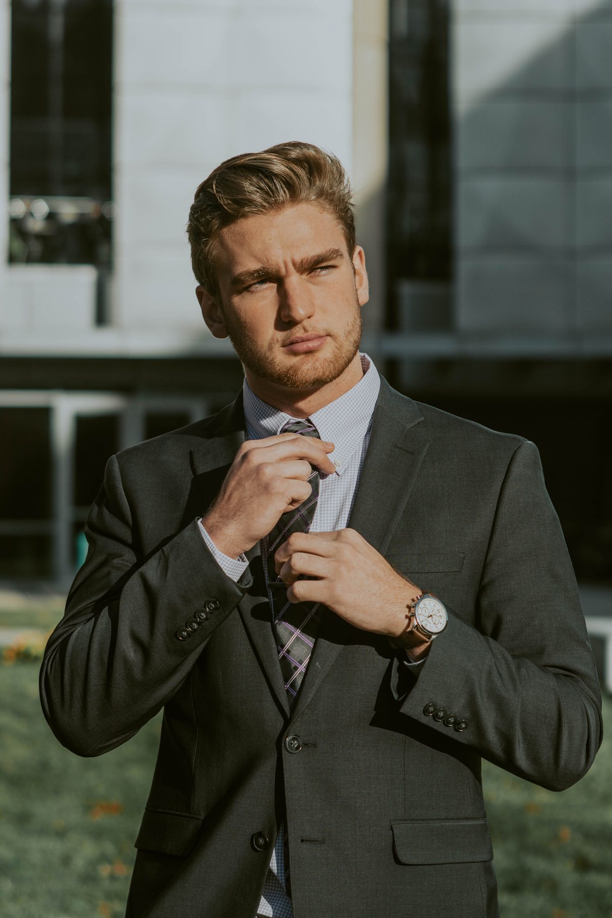 Downtown Tie Adjuster hairstyle shown on a professional man.