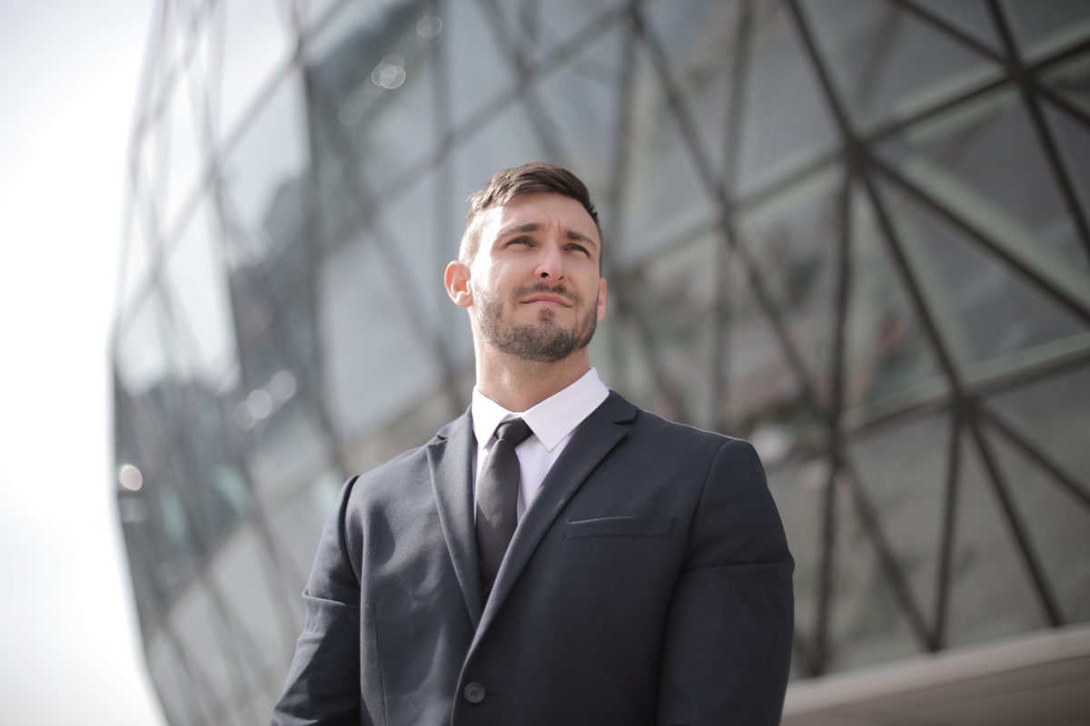 Corner-Office Confidence hairstyle shown on a professional man.