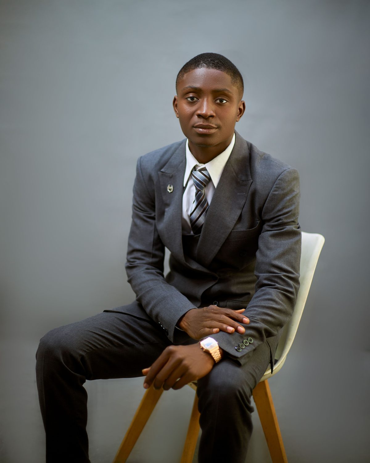 Boardroom Portrait Cut hairstyle shown on a professional man.