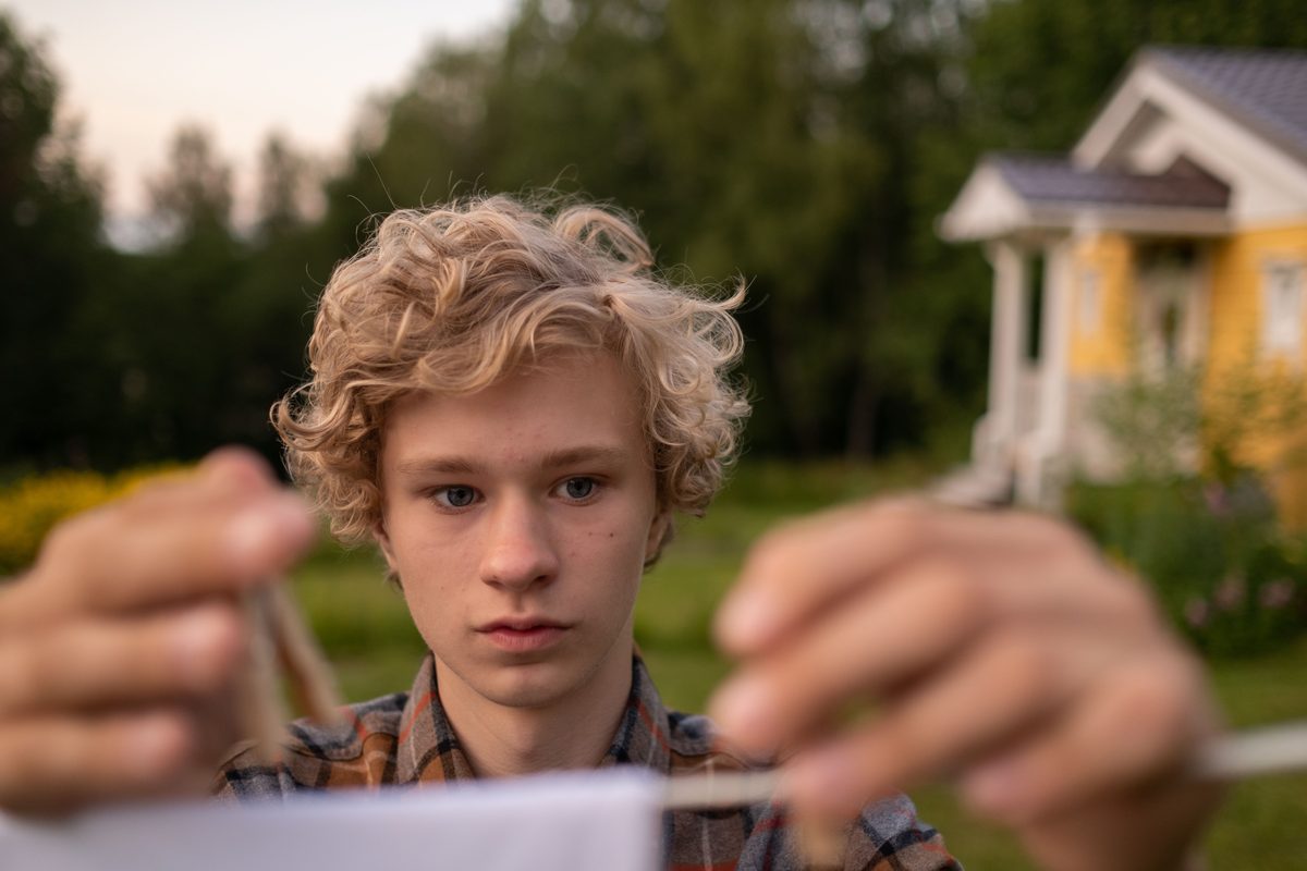 Curly outdoor teen hairstyle shown on a teenager.