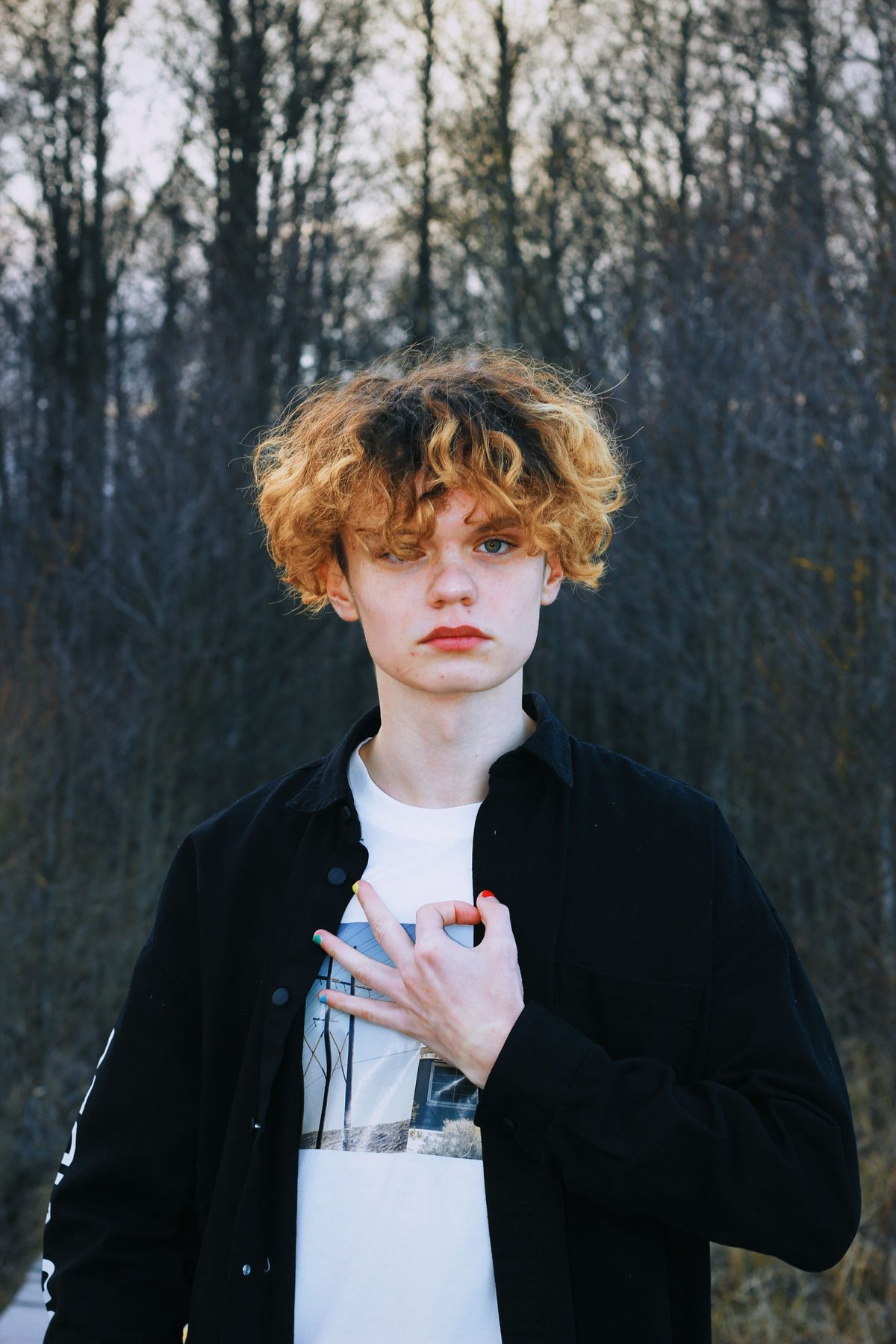 Curly hair studio shot hairstyle shown on a teenager.