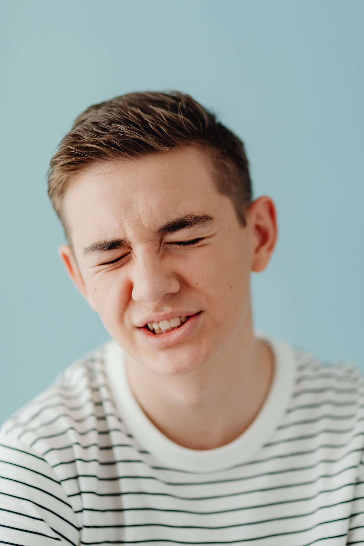 Close-up teen portrait hairstyle shown on a teenager.
