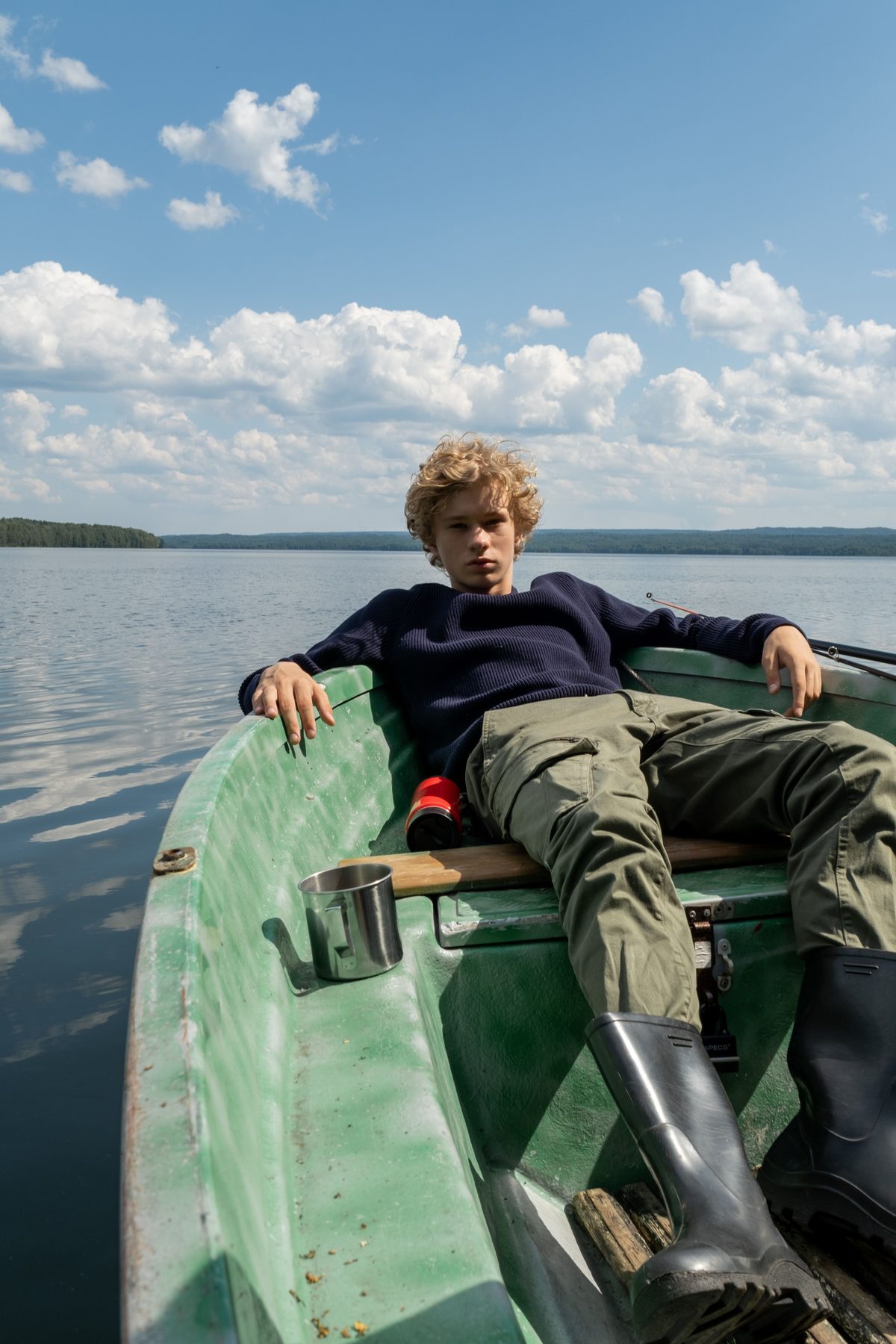 Curly teen in boat hairstyle shown on a teenager.