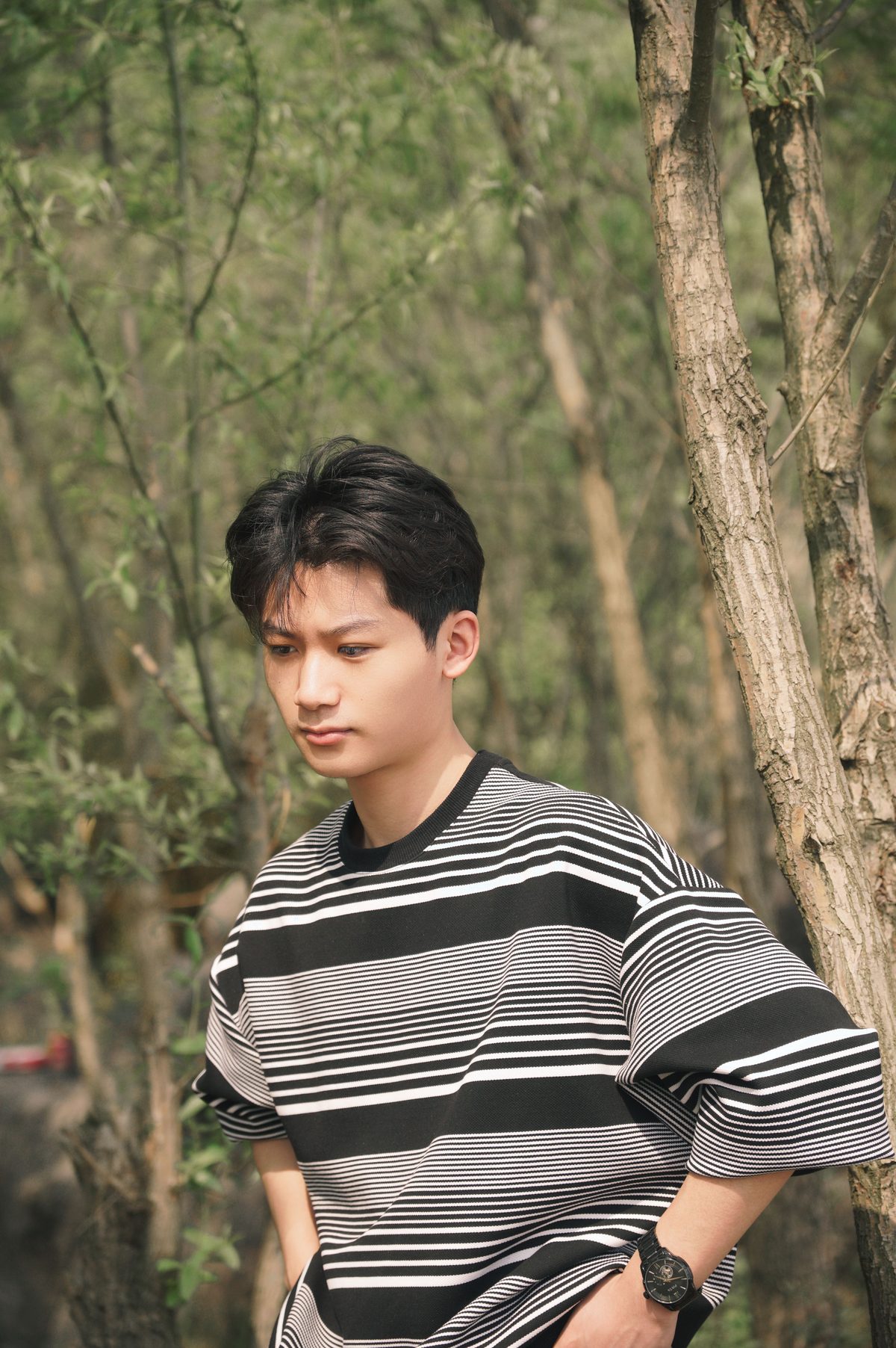 Striped sweater forest teen hairstyle shown on a teenager.