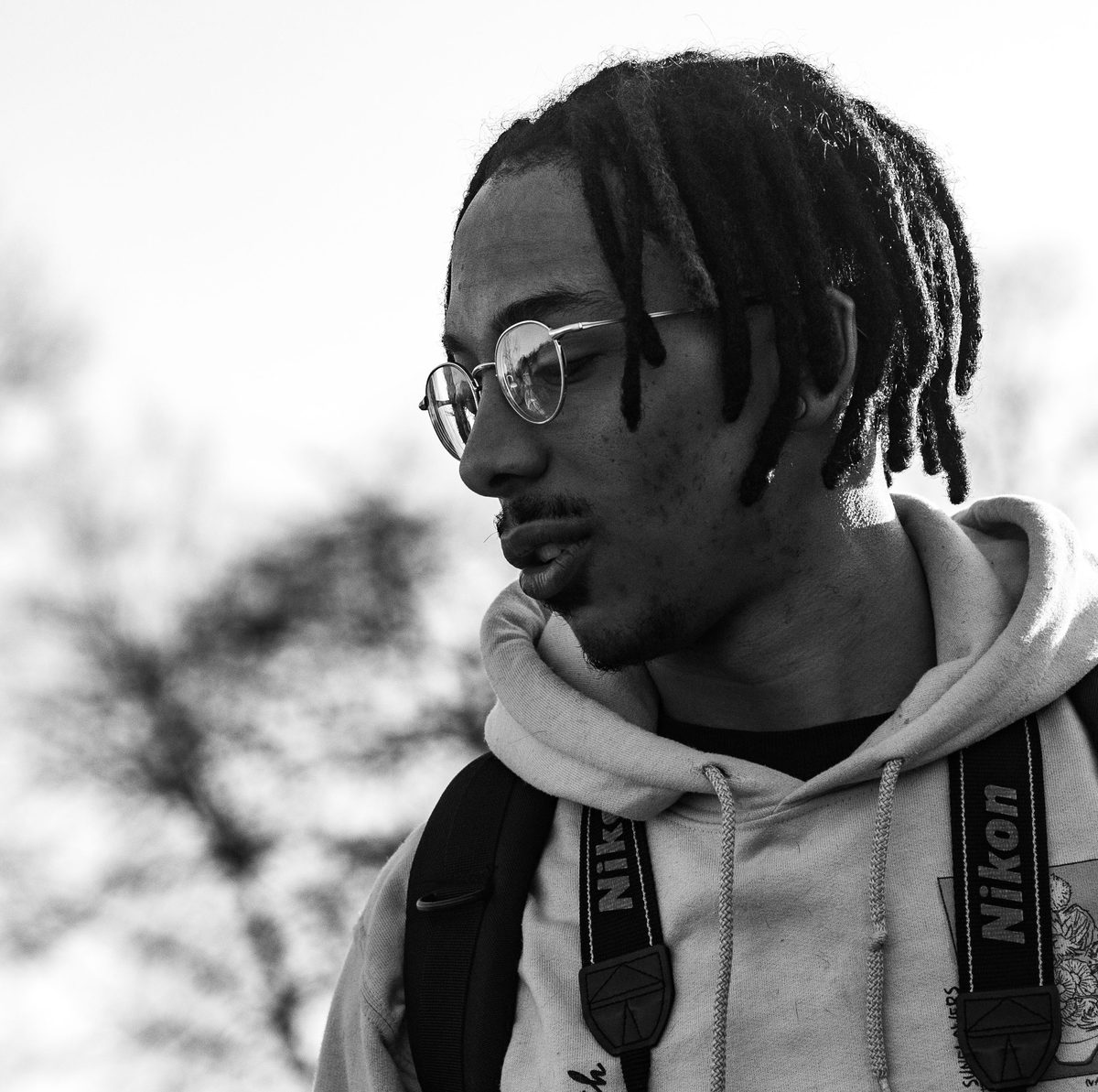 Dreadlocks B&W portrait hairstyle shown on a young man.