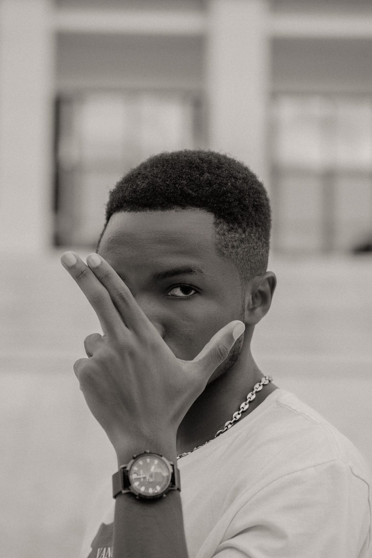 Stylish outdoor cut hairstyle shown on a young man.