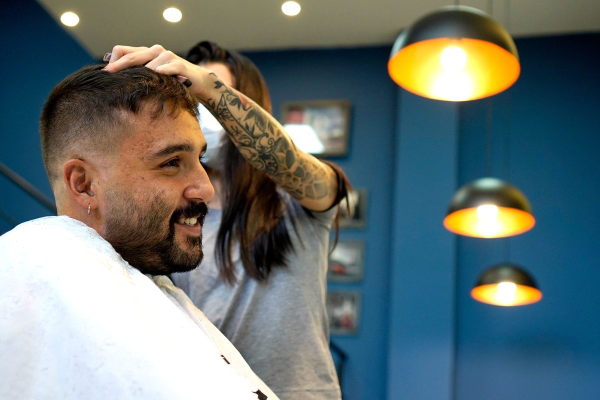 Modern salon cut hairstyle shown on a young man.