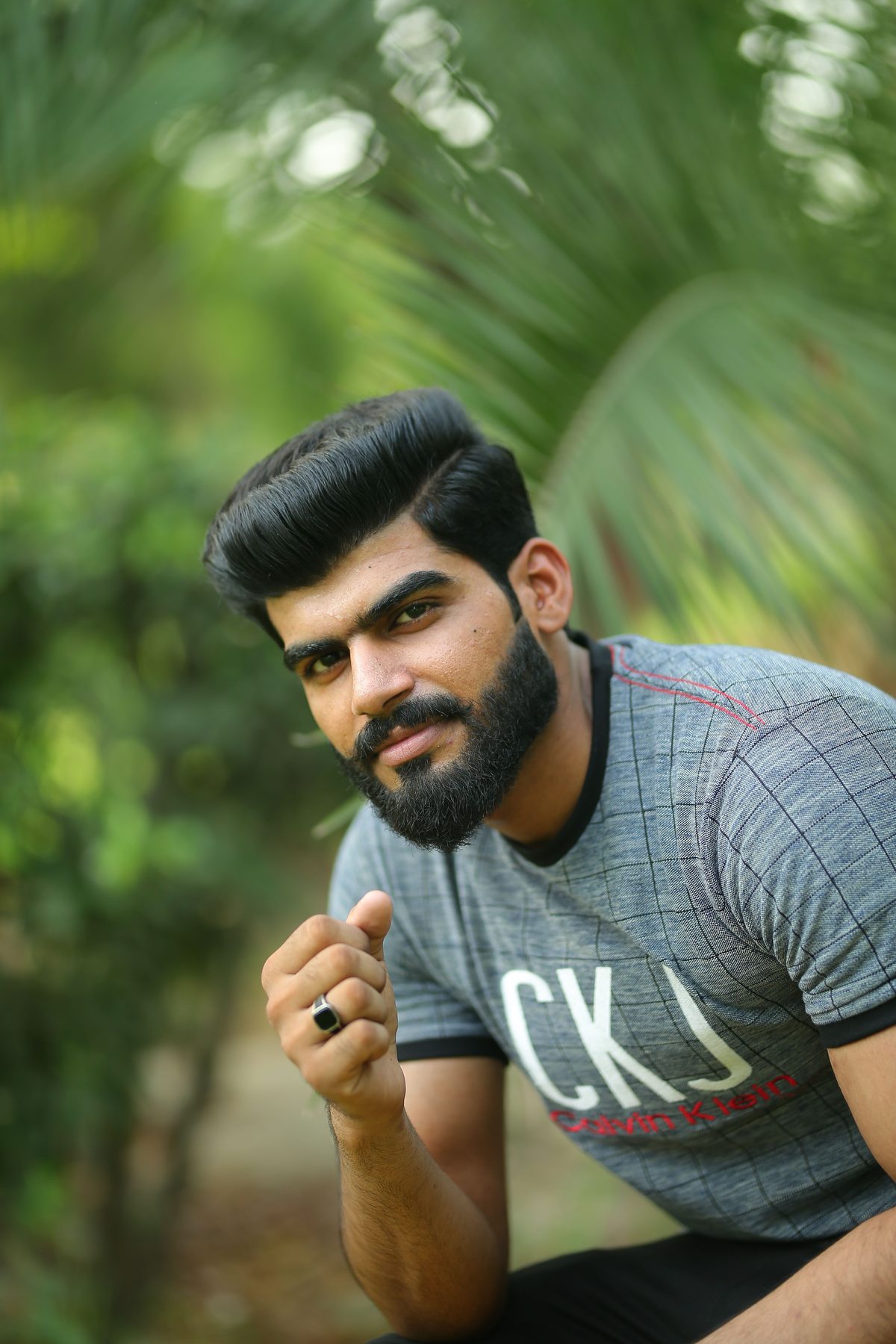 Neat cut beard blend hairstyle shown on a young man.