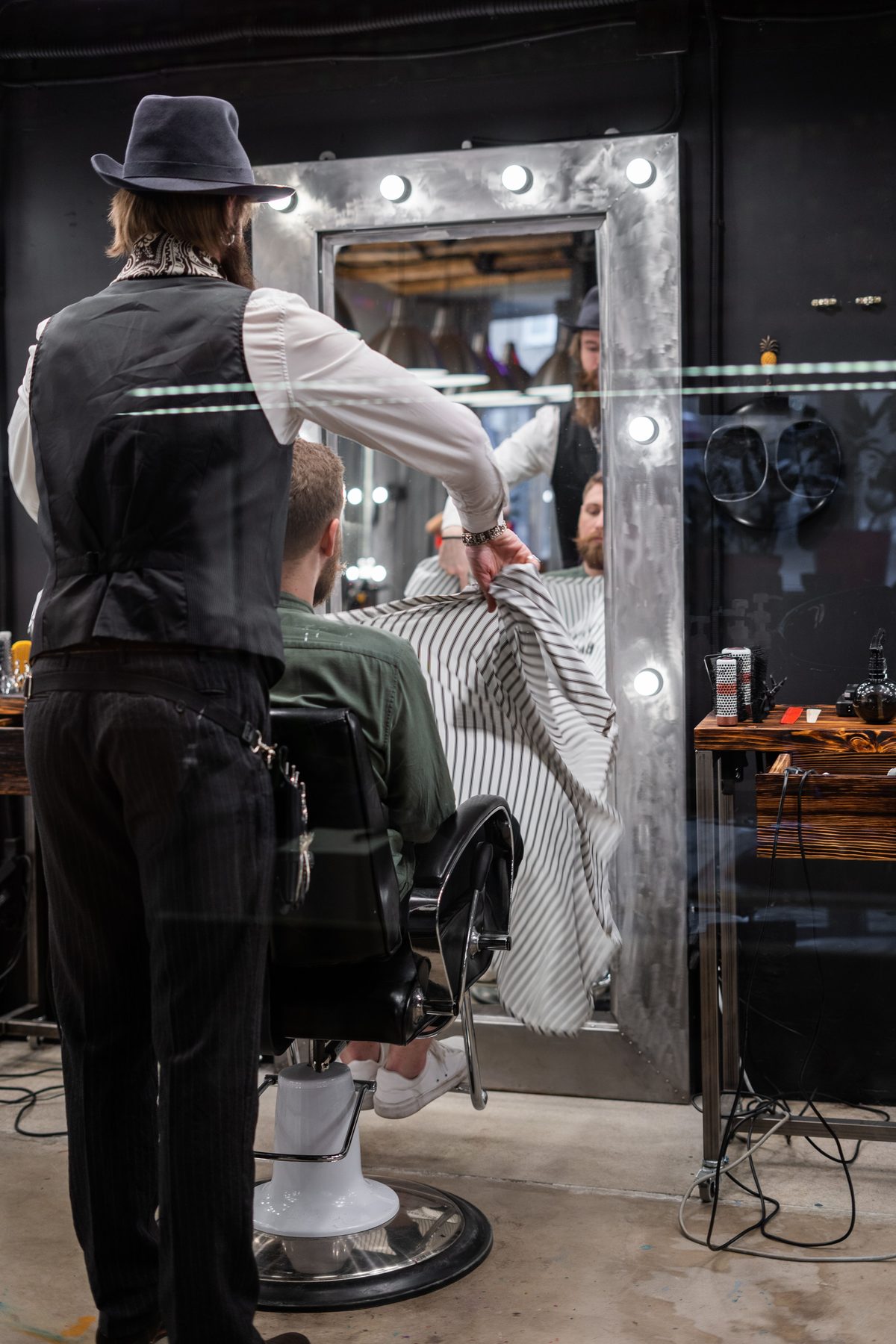 Urban barbershop style hairstyle shown on a young man.