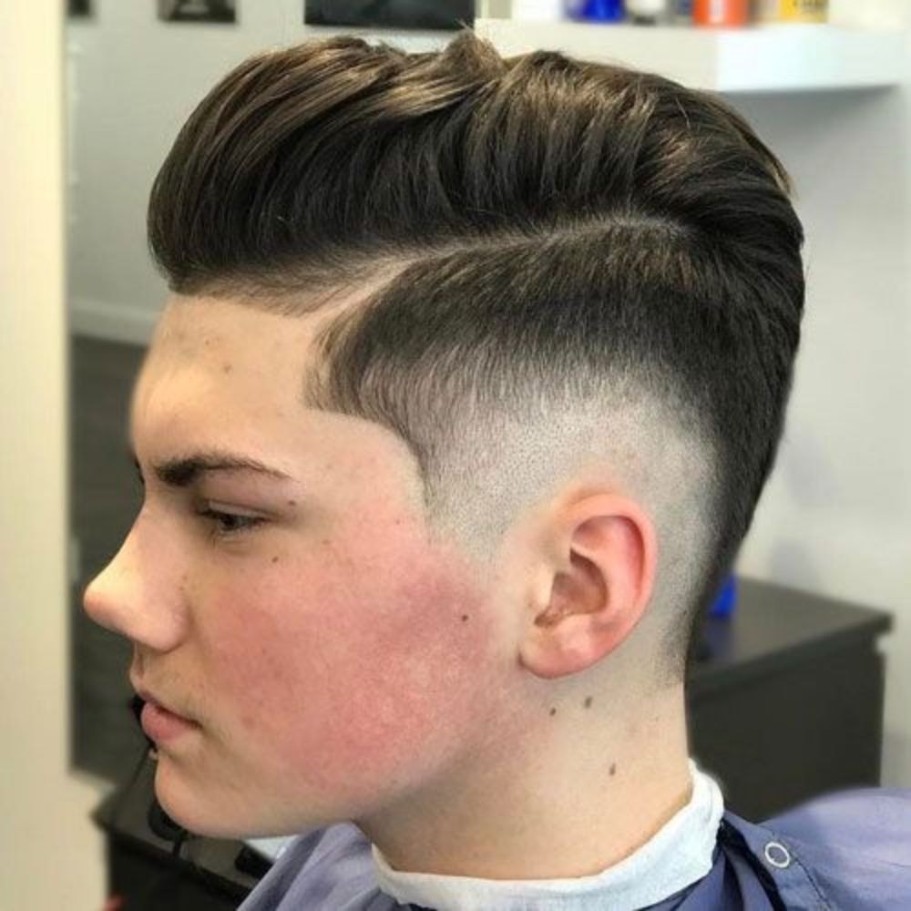 Low Burst Fade haircut reference showing soft temple transition