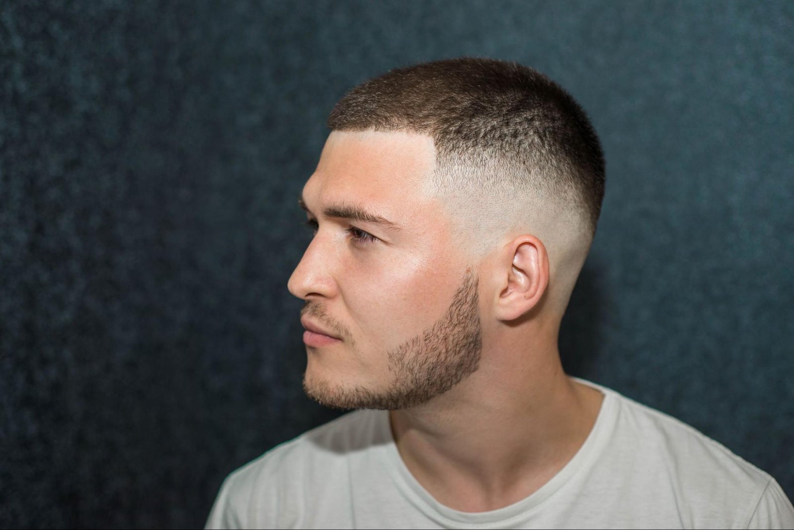 Mid Burst Fade haircut reference showing defined curl finish