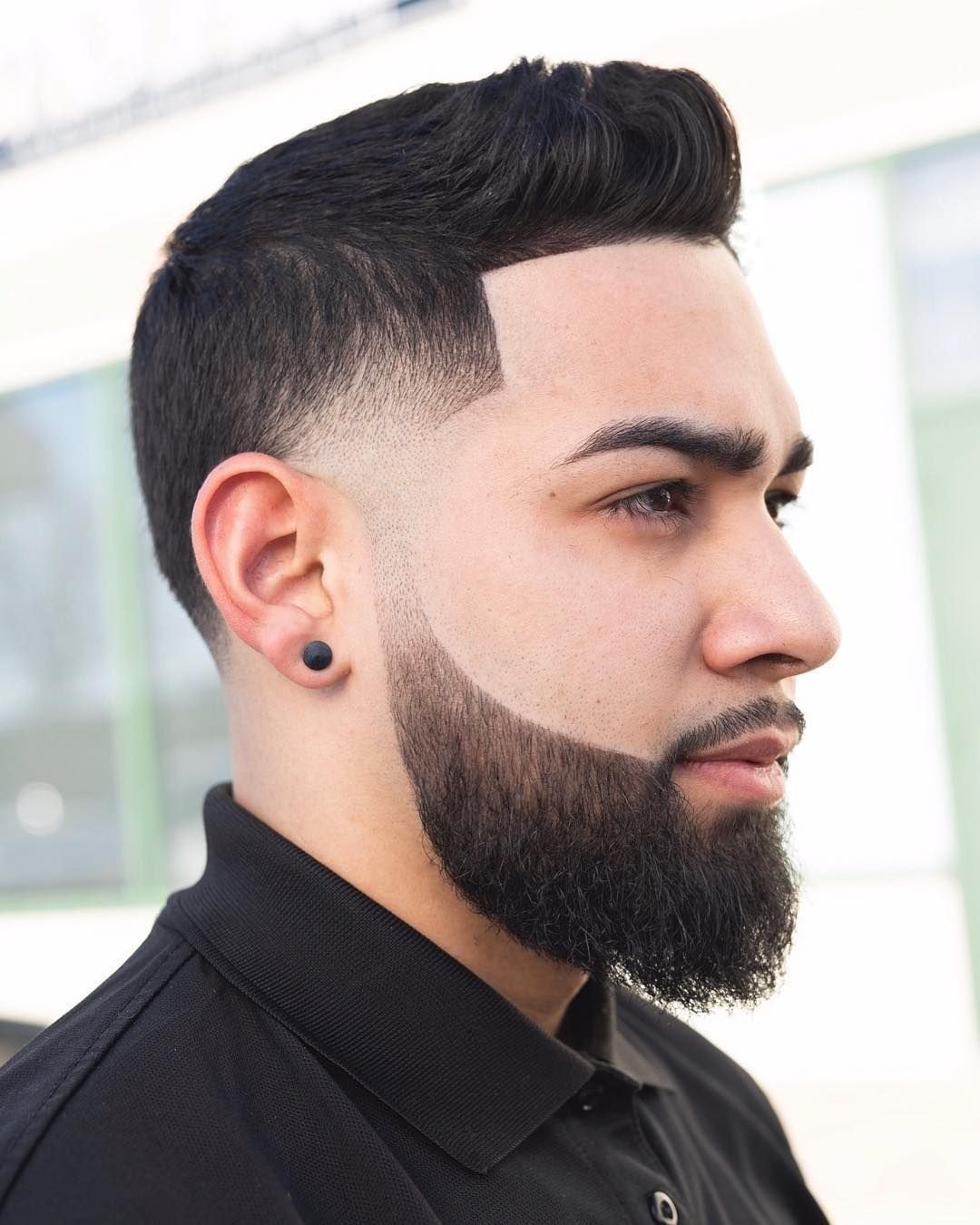 Low Burst Fade haircut reference showing the low-profile arc