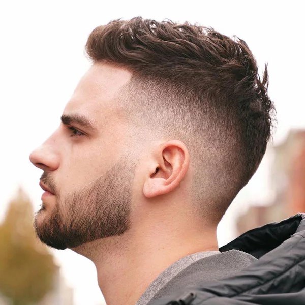 Mid Burst Fade haircut reference showing editorial sharp finish