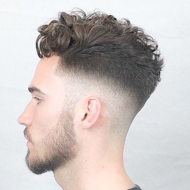 Essential Burst Fade haircut reference showing defined curl finish
