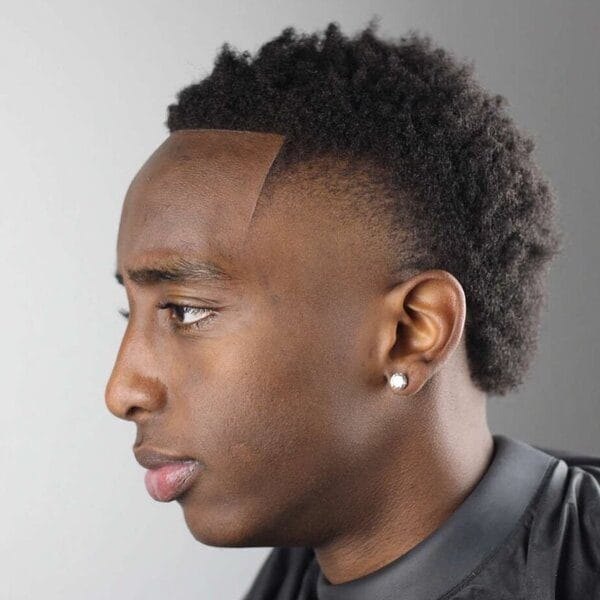Low Burst Fade haircut reference showing textured forward top