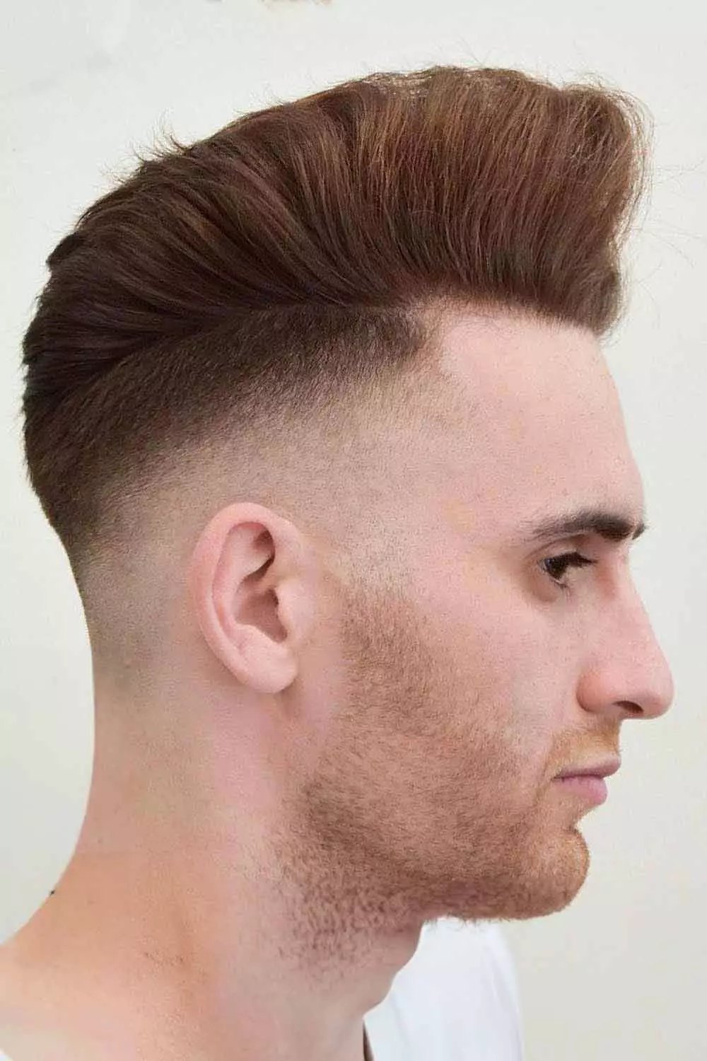 Low Burst Fade haircut reference showing the clean mid burst