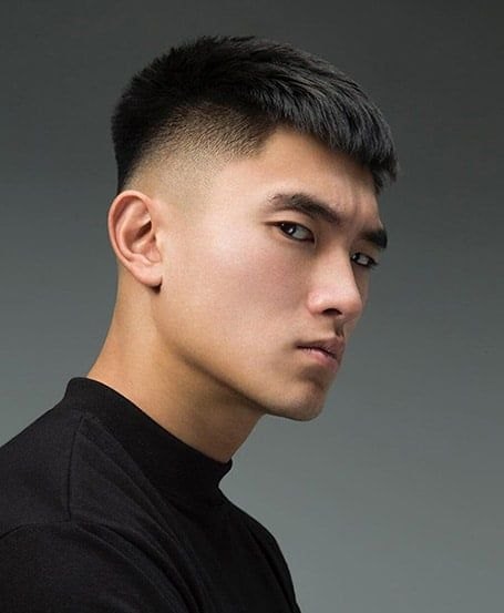 Low Burst Fade haircut reference showing textured forward top