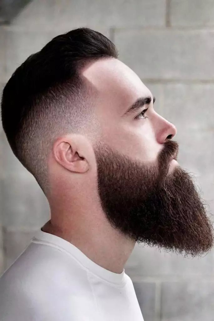 Low Burst Fade haircut reference showing defined curl finish