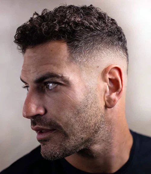 Mid Burst Fade haircut reference showing loose natural movement