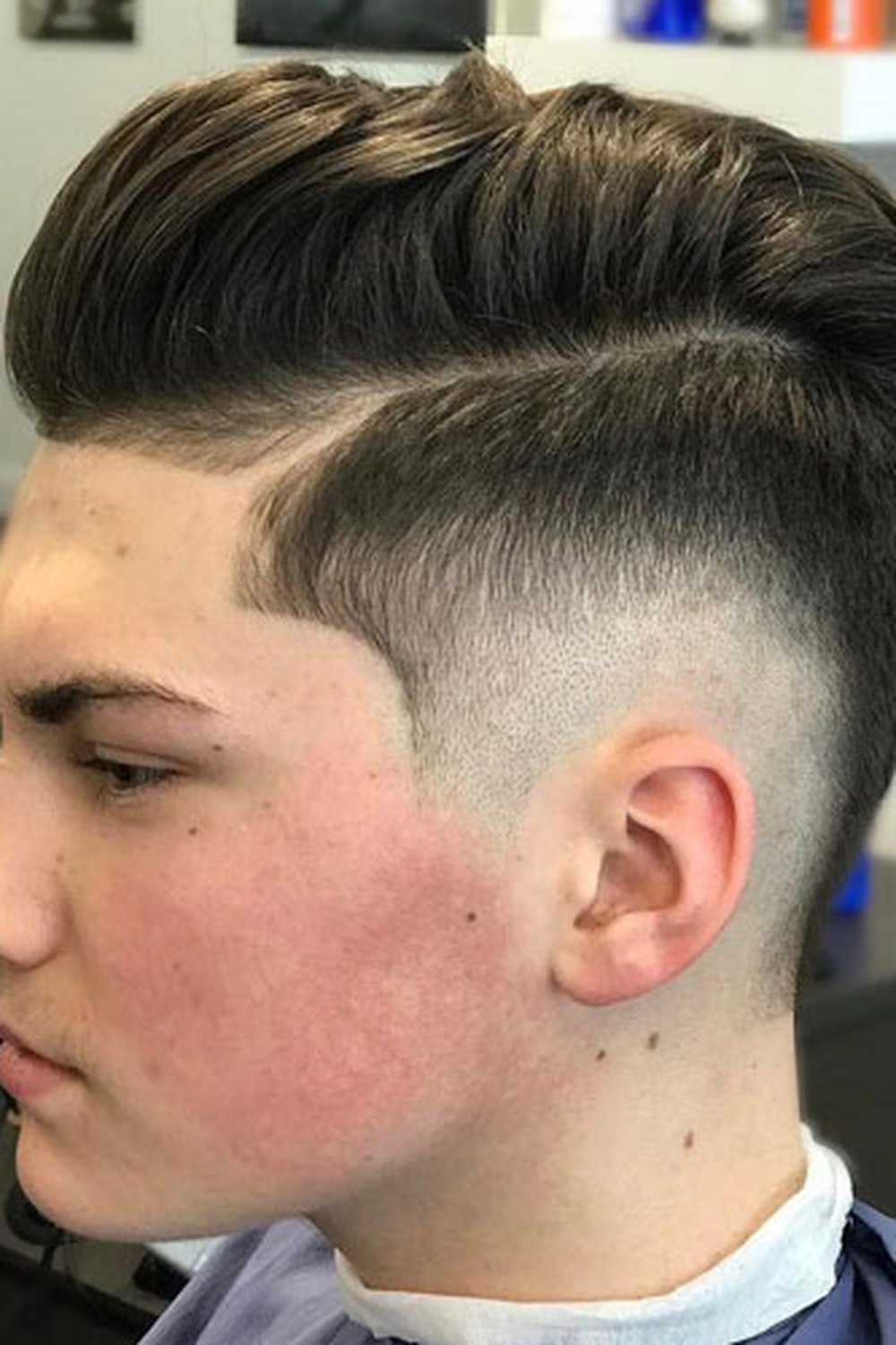Teen boy with a classic short burst fade — neat, school-friendly cut