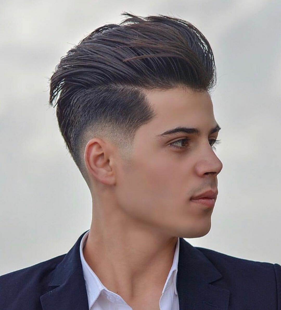 Long pompadour swept up and back, outdoor side view