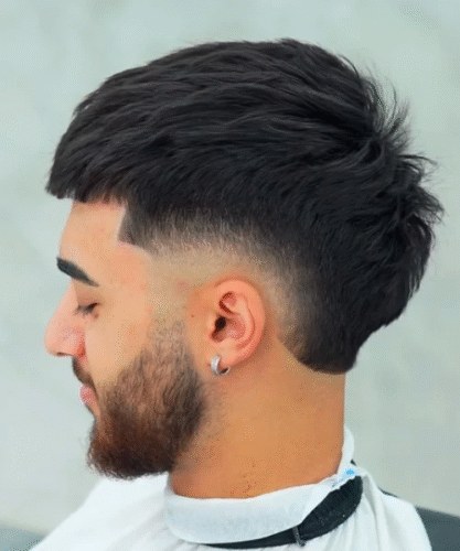 Wavy medium-length top connected to a clean low burst and beard.