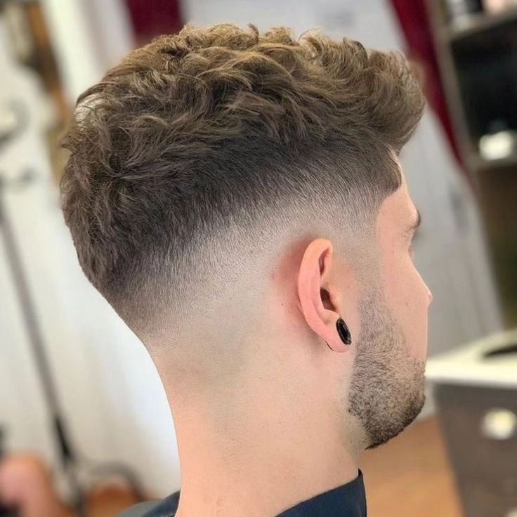 Mid Burst Fade haircut reference showing textured forward top