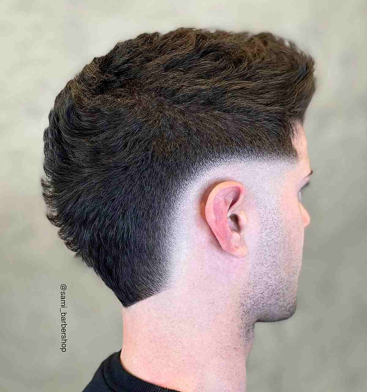 High Burst Fade haircut reference showing the clean mid burst