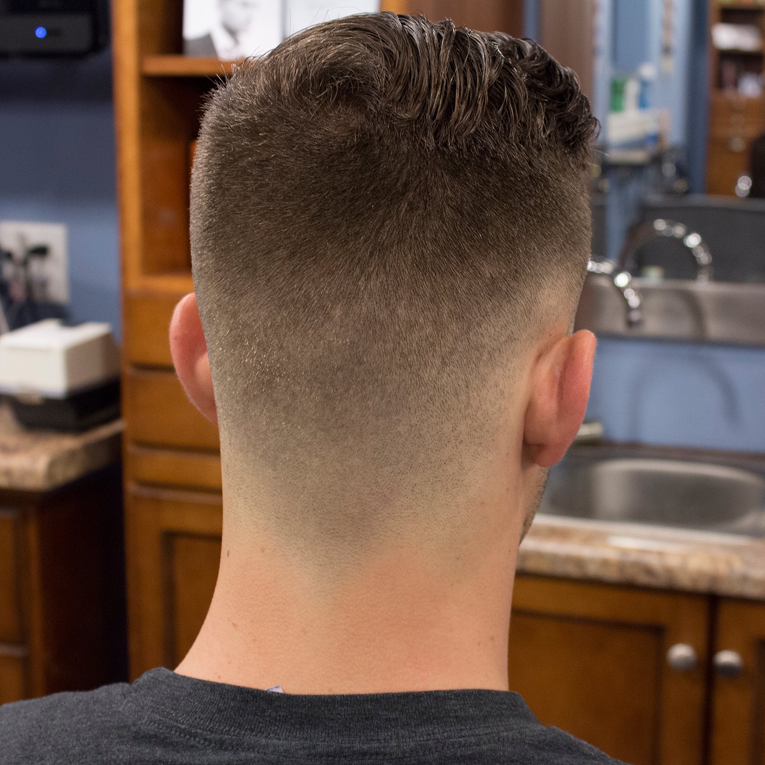 Faux Hawk Burst Fade haircut reference showing the low-profile arc