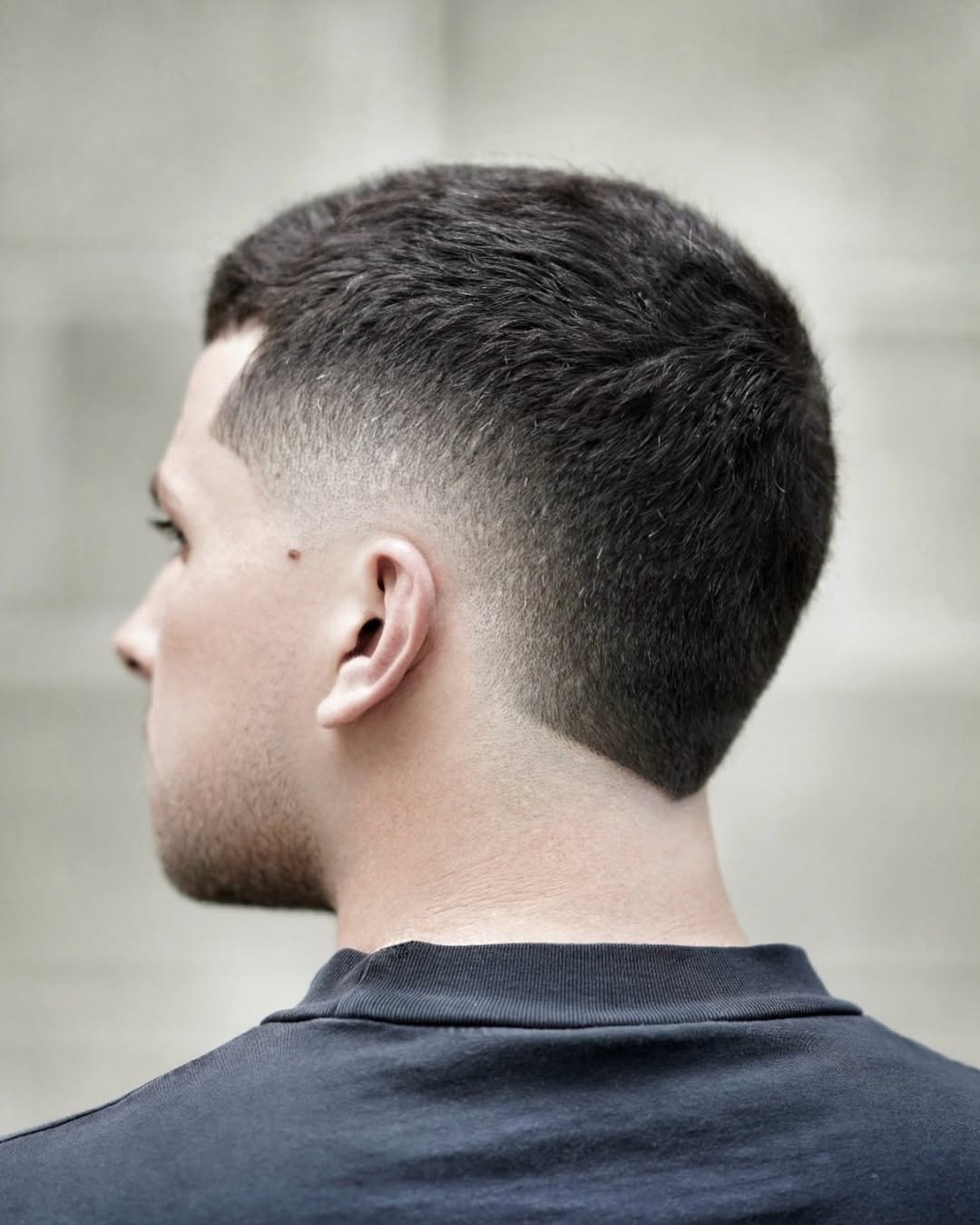 Mid Burst Fade haircut reference showing disconnected statement