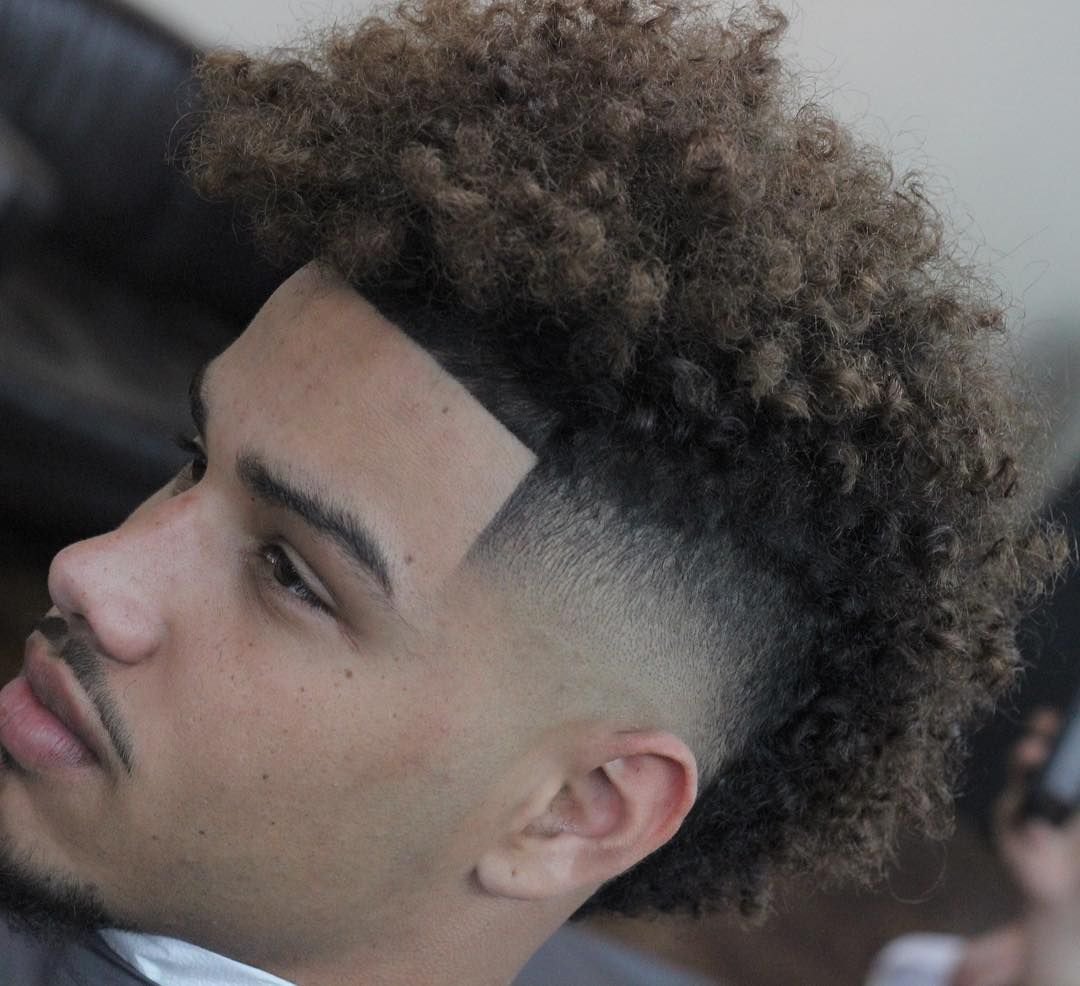 Faux Hawk Burst Fade haircut reference showing loose natural movement