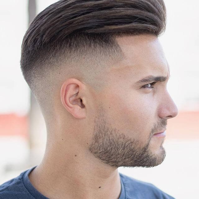 Wavy Burst Fade haircut reference showing the low-profile arc