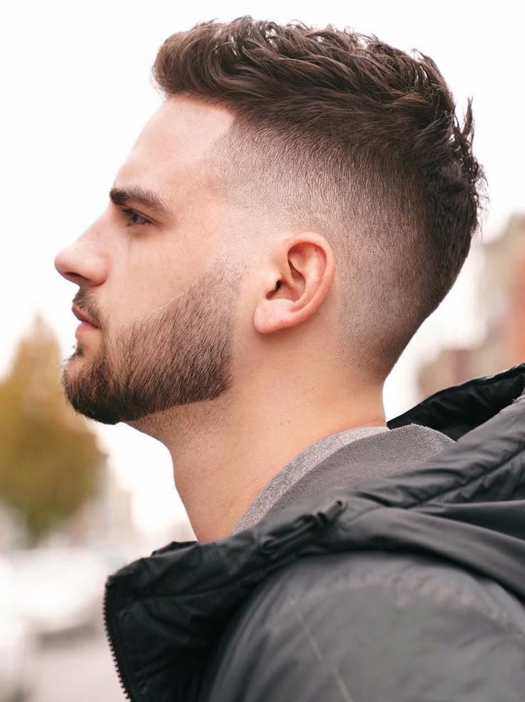 Curly Burst Fade haircut reference showing the high-contrast version