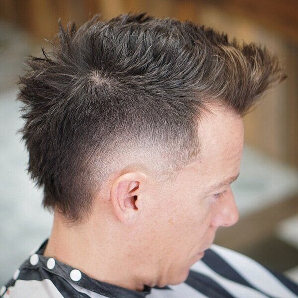 Burst Fade Taper haircut reference showing defined curl finish