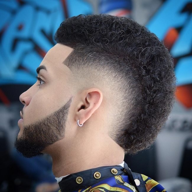 Curly Burst Fade haircut reference showing the high-contrast version