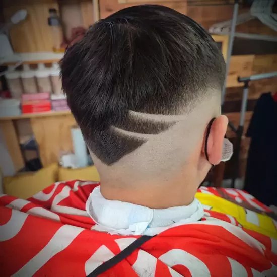 Low Burst Fade haircut reference showing defined curl finish